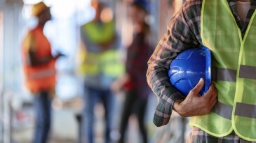 Man holding blue helmet close up