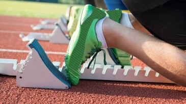 Feet on starting block ready for a spring start.