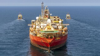 Boskalis vessels tow the FPSO Fluminense from Brazil to the Modern American Recycling Services yard in Denmark using the Boka Summit and Boka Glacier as leading tugs. The Manta, not pictured, served as an escort tug. Source: Boskalis.