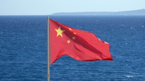 Chinese national flag at the coast near the sea
