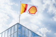 Shell flag over building.
