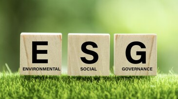 words ESG on a wood block and Future environmental conservation and sustainable ESG modernization development by using the technology of renewable resources to reduce pollution and carbon emission.