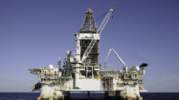 A floating deep water semi-submersible oil drilling on location at sea