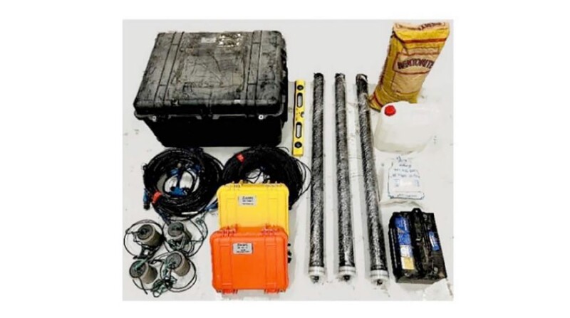 Fig. 1—Components of EM system showing data logger, electrodes, induction coils, and web access box.