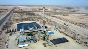 Drone View Of Oil Or Gas Drill Fracking Rig Pad As The Sun Rises In New Mexico