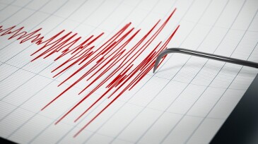Seismograph recording the seismic activity of an earthquake