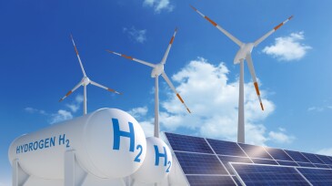 Hydrogen tank, solar panel and windmills with sunny blue sky