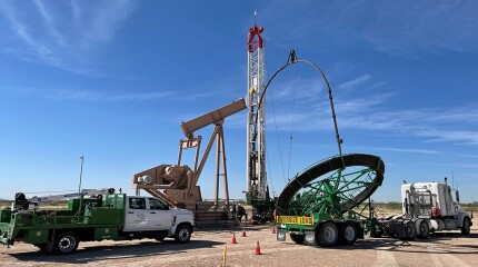 Running a continuous sucker rod into a well in the Permian.