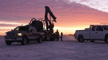Oil Field Workers at Sunrise