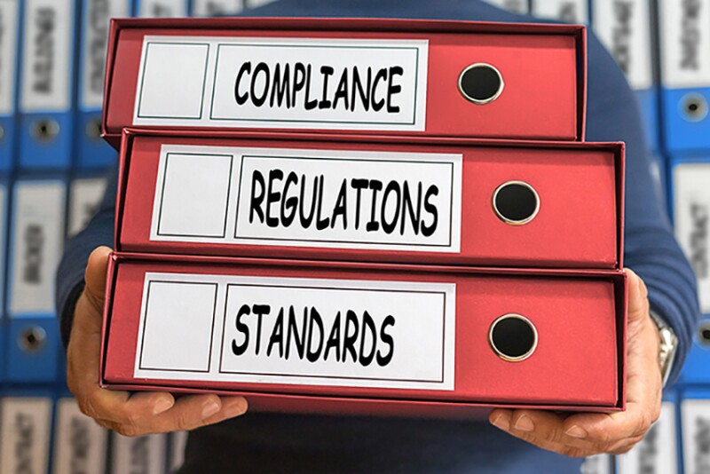 Regulations, Compliance, Standards, concept words. Folder concept. Ring binders.