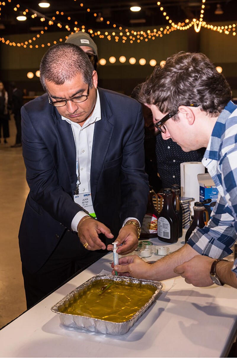 SPE Calgary Section demonstrating the concept of hydraulic fracturing with Jell-O at the 2019 ATCE STEM Workshop for teachers.