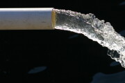 Close-up of water pipe with pouring water