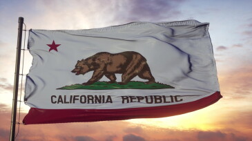 Flag of California waving in the wind against deep beautiful sky. 3d illustration