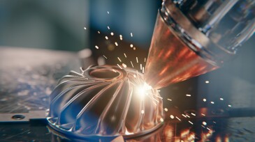 A modern 3D printer is printing a metal turbine. The future of machine part manufacturing.