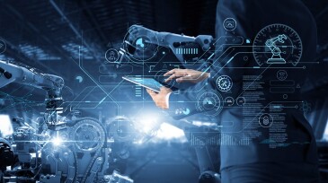 Manager Technical Industrial Engineer working and control robotics with monitoring system software and icon industry network connection on tablet. AI, Artificial Intelligence, Automation robot arm