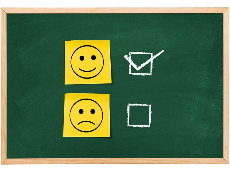 Smiley faces representing happy and sad