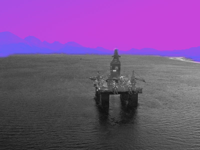 Platform in ocean with colorized sky