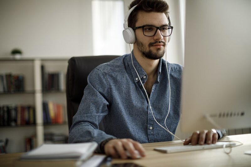 Man at computer completing training