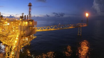Offshore oil and gas or rig platform with beautiful sky in the evening time for oil and gas business concept.