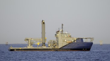 Subsea work vessel with knuckle crane and lift tower