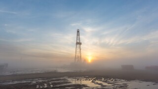 Fracking oil rig in the morning fog